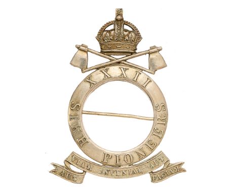 Indian Army. 32nd Sikh Pioneers pagri badge circa 1903-22.  A fine large British made die-stamped white metal Sikh quoit insc