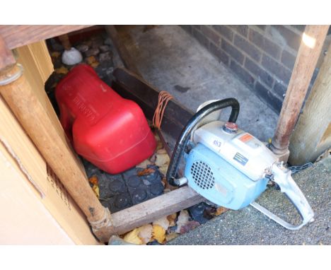 Petrol Chainsaw and a Large Red Gasoline Can 