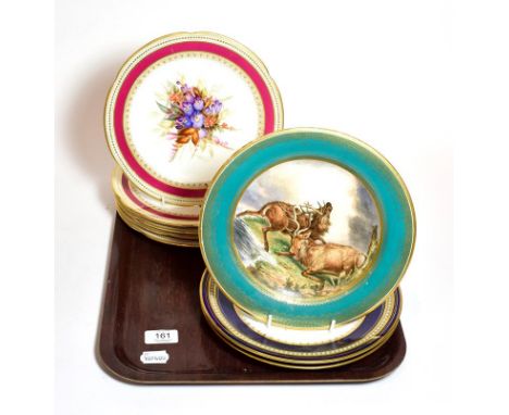 A set of five Royal Worcester floral painted dessert plates with red borders, a pair of blue and gilt floral painted plates a