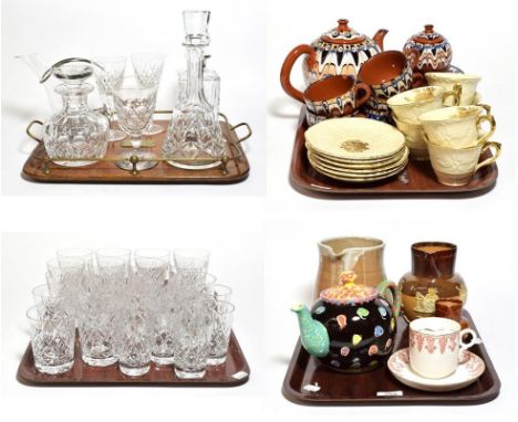 An oak serving tray with brass gallery, a cut glass whisky decanter with silver mount, two other cut-glass decanters, a quant
