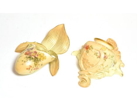 Two Royal Worcester wall pockets, each painted with flowers on a blush ivory ground