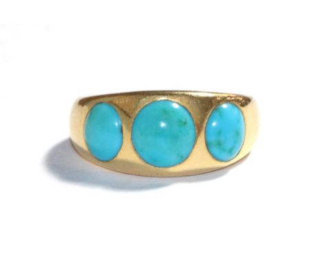 A turquoise ring, the graduated round cabochon turquoise inset in a yellow plain polished shank, finger size M1/2.  Indistinc