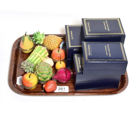 A group of ten Halcyon Days enamel trinket boxes in the form of fruit and vegetables