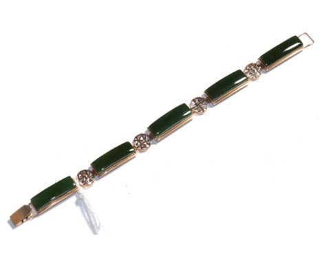 A jade type bracelet, stamped '18K', length 18.5cm .  Gross weight 19.6 grams