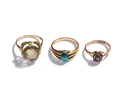 A turquoise matrix ring, stamped '18CT', finger size Q, a 9 carat gold citrine ring, finger size R, and a 9 carat gold amethy