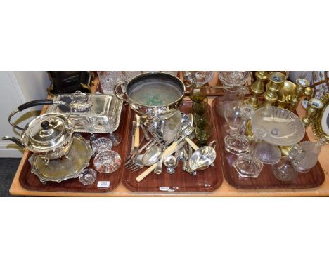 A quantity of silver-plated flatware, twin-handled bowl, entree dish, spirit kettle, brass candlesticks, glass, etc (three tr