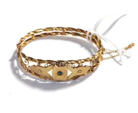 A sapphire and diamond hinged bangle, stamped '9CT'.  Gross weight 11.14 grams 