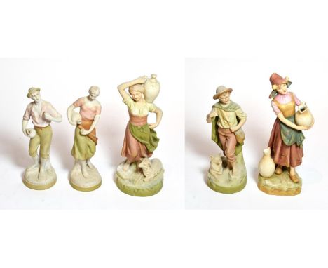 Five various post 1919 Royal Dux figures including four water carriers and a boy and dog, tallest 28cm 