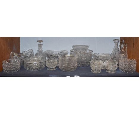 A large quantity of cut crystal and glasswares, comprising fruit bowls, decanters, three graduated basket style bowls, side p