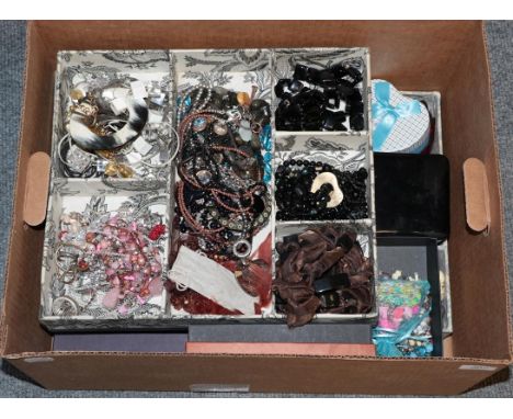 A quantity of costume jewellery, including amber type necklaces, bead necklace and bracelets, bangles, a coral necklace, ring