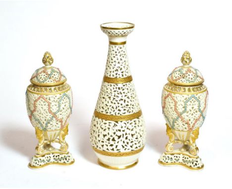 A pair of Royal China works, Worcester reticulated vases and covers, together with a similar vase, tallest 25cm 