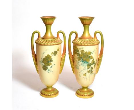 A pair of Royal Worcester blush ivory floral painted twin handled vases, shape number: 2129, 31cm high 