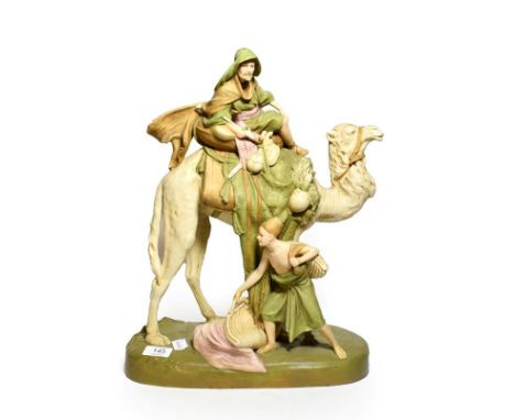 Post 1919 Royal Dux model of an Arabian astride a camel with another figure beside, model number: 1751, 45cm high 