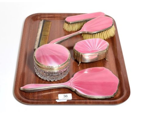 A five-piece George V and George VI silver and pink enamel dressing-table service, by Barker Brothers Silver Ltd. Birmingham,