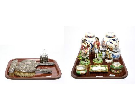 A three piece silver backed dressing table set, a scent bottle, a pair of Sitzendorf figures, a pair of Capodimonte figures, 