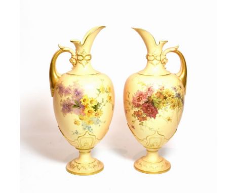 A pair of Royal Worcester blush ivory floral painted ewers, shape number: 1581, 34cm high 