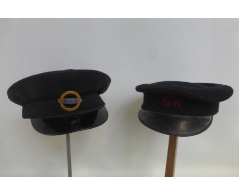 A London Transport cap, size 6 7/8" with part enamel badge to the front no. 2059 and a GWR cap.