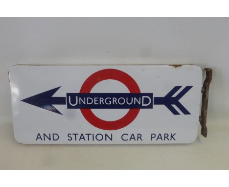 A pair of Underground directional enamel signs back to back with original bracket, 24 3/4 x 10 1/2".