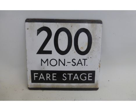 A black and white Transport plaque - 200 Monday to Saturday fare stage, 5 x 5".