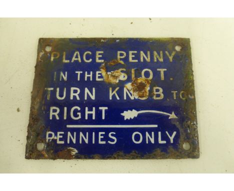 A small blue and white enamel vending machine plaque - Place penny in the slot, turn knob to right, 3 1/2 x 2 3/4".