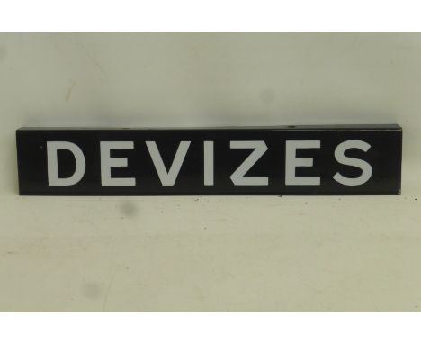 A black and white enamel destination sign for Devizes, top flange, 17 1/4 x 3".