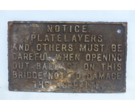 A cast iron rectangular notice plaque relating to plate layers, 16 1/4 x 9 3/4".