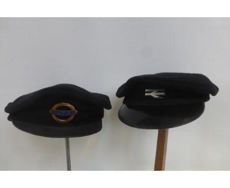 A London Transport cap with part enamel badge to the front no. 2363 and a British Railways cap.