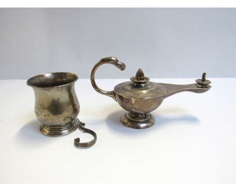 A silver oil lamp with bird form handle weighted base, marks rubbed.  A silver cup a/f (2)