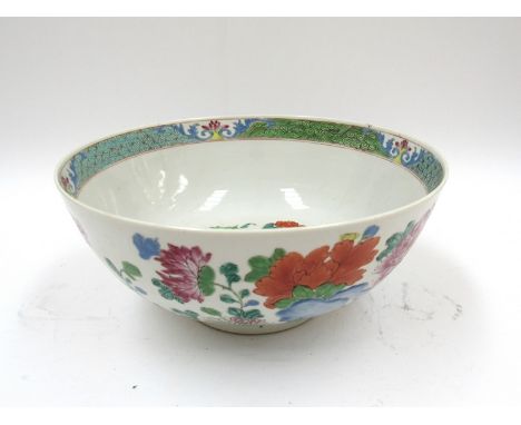 A Chinese porcelain bowl, floral decorated a/f, 26cm diameter