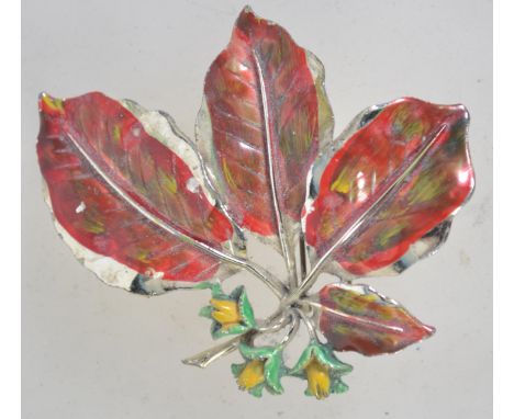 A 1960s goldtone and enamel beech nut brooch from the leaf series by Exquisite. Marked Exquisite on verso. Measures 7cms