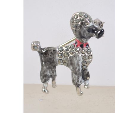 A vintage white metal enamel and marcasite figural brooch in the form of a poodle having a roller clip clasp. Measures 3cms .