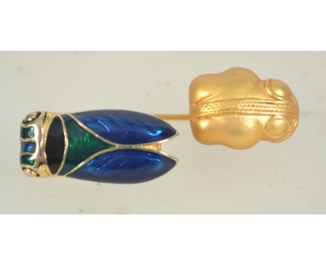 A vintage cicada enamel brooch together with a gold plated beetle pin.