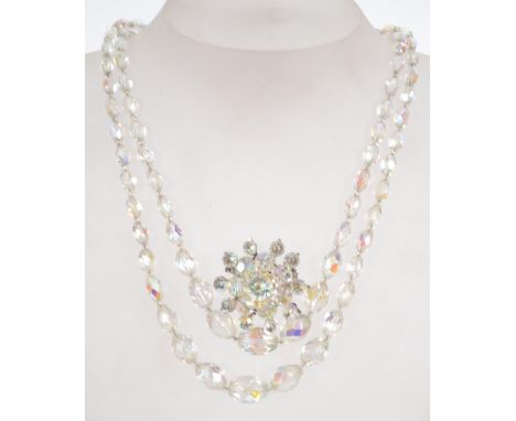 A vintage AB crystal necklace and brooch . The necklace having a rhinestone set clasp the brooch having a roller clasp.  Neck