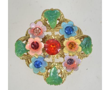 A 1950s Czech filigree and enamel brooch with rhinestones having loop catch. Measures 4.5cms