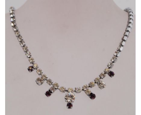 A vintage prom necklace and brooch set the necklace having a spring hoop clasp and the brooch a roller clasp.