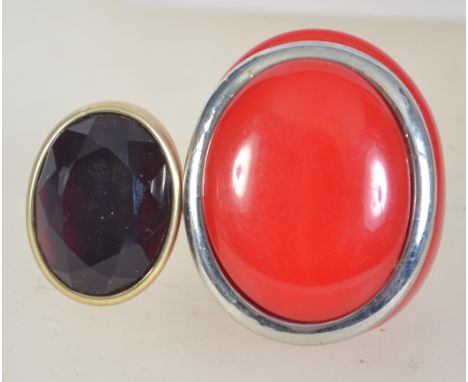 Two vintage dress rings, one with purple faceted stone and the other red bakelite with chrome ring. Sizes S & M