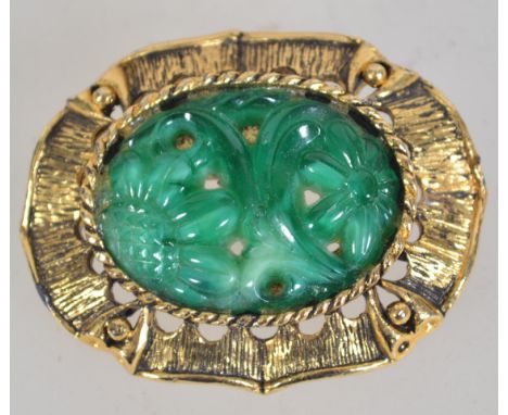A vintage gold tone peking glass brooch with roller clip clasp. Measures 4.5cms.