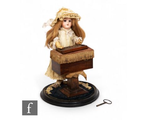 An early 20th Century&nbsp;Schoenau &amp; Hoffmeister bisque headed '5700' doll musical automation, in period dress, standing