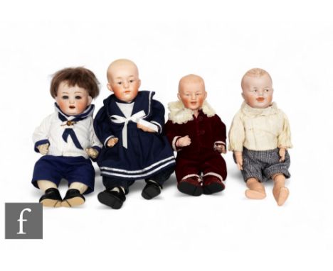 Four Early 20th Century bisque head boy dolls, Heubach Koppelsdorf 267.7/0, with open mouth and teeth, sleeping eyes, a Gebru