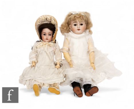 Two early 20th Century bisque head dolls,&nbsp;Curnen &amp; Steiner with impressed 'C&amp;S' mark to rear of head, the other 