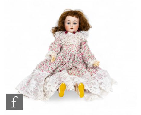 An early 20th Century&nbsp;Kammer &amp; Reinhardt bisque head '46x' doll, open mouth with teeth, fixed blue glass eyes, impre