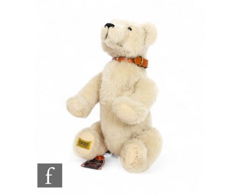 A Merrythought limited edition dog with white body and leather collar, numbered 2 of 8, with tags, length 40cm.