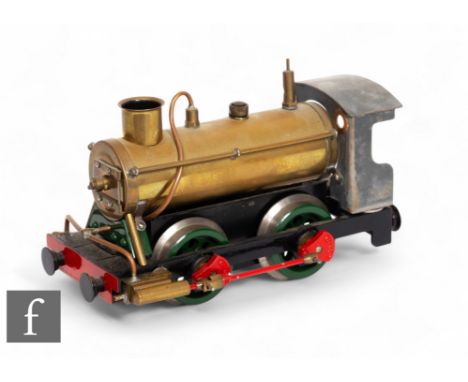 A scratch built live steam 0-4-0 steam engine with brass boiler with white metal cab, chassis possibly by Mamod, length 23cm,
