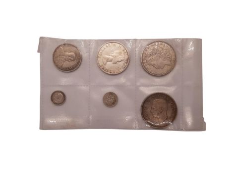 USA, a 1921 silver Morgan Dollar, George VI, 1936-1952, a 1937 Crown together with a 1958 Canada Dollar etc (6).