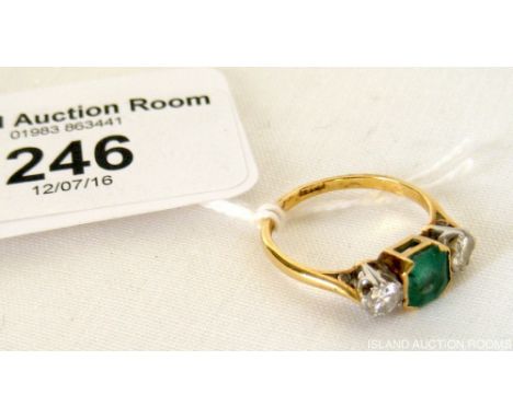 Emerald and diamond ring in gold setting