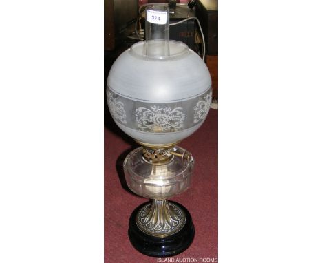 A Victorian oil lamp with glass reservoir - 50cm high