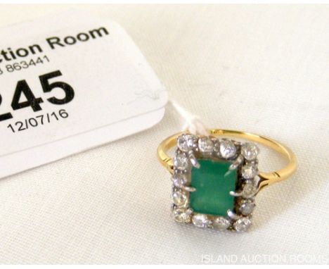 Emerald and diamond ring in gold setting