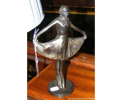 An unusual lighter in the form of a bronzed dancing girl - 24cm high