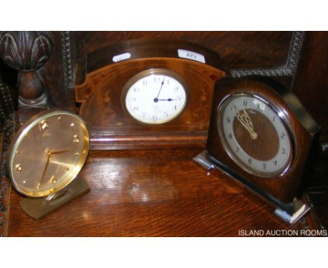 An inlaid Edwardian mantel clock, together with two others