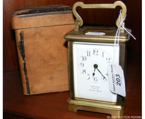 A Benzie of Cowes brass cased carriage clock with travelling case